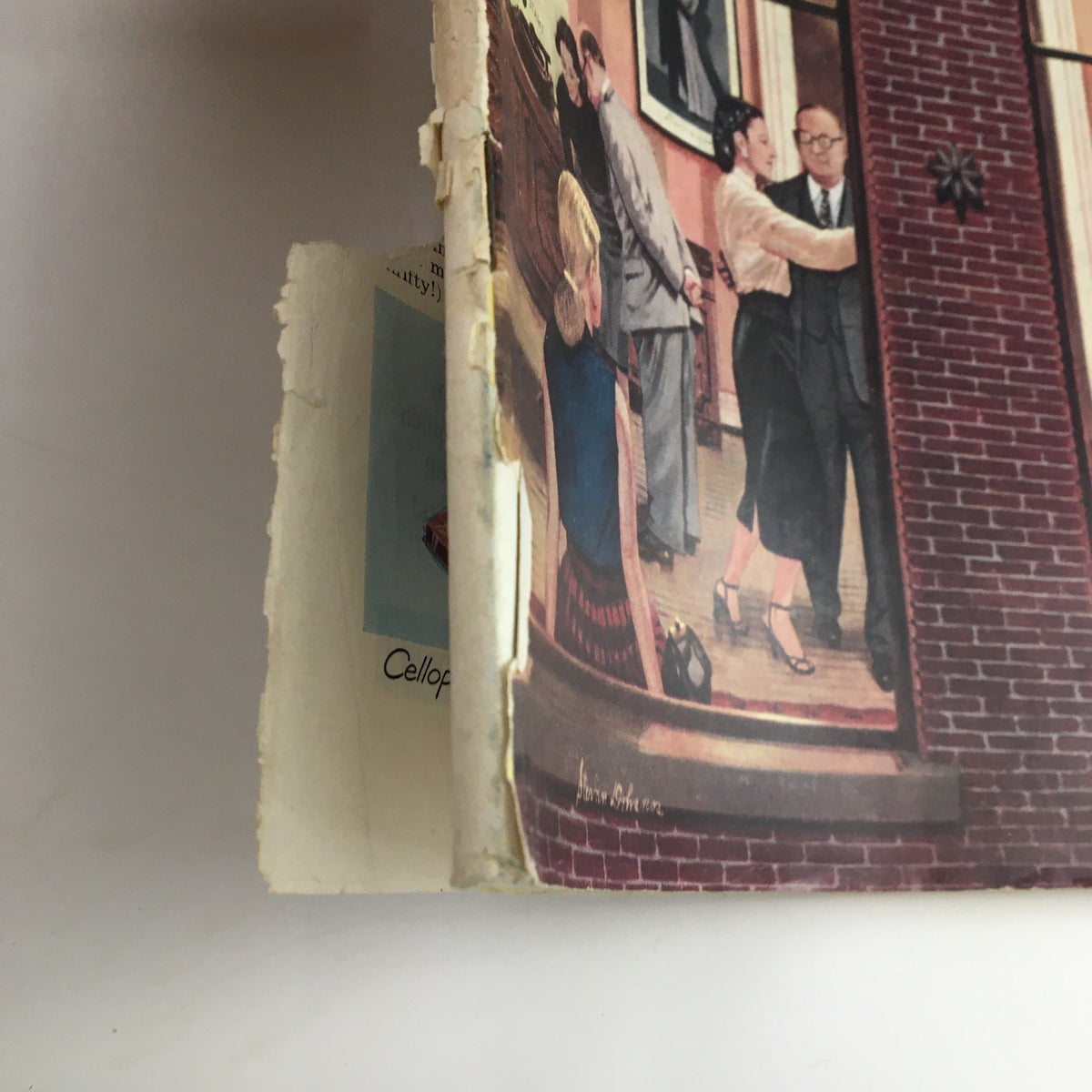 Side view of The Saturday Evening Post, May 10, 1952, displaying the interior artwork and binding condition, highlighting the magazine's status as a collectible vintage item.