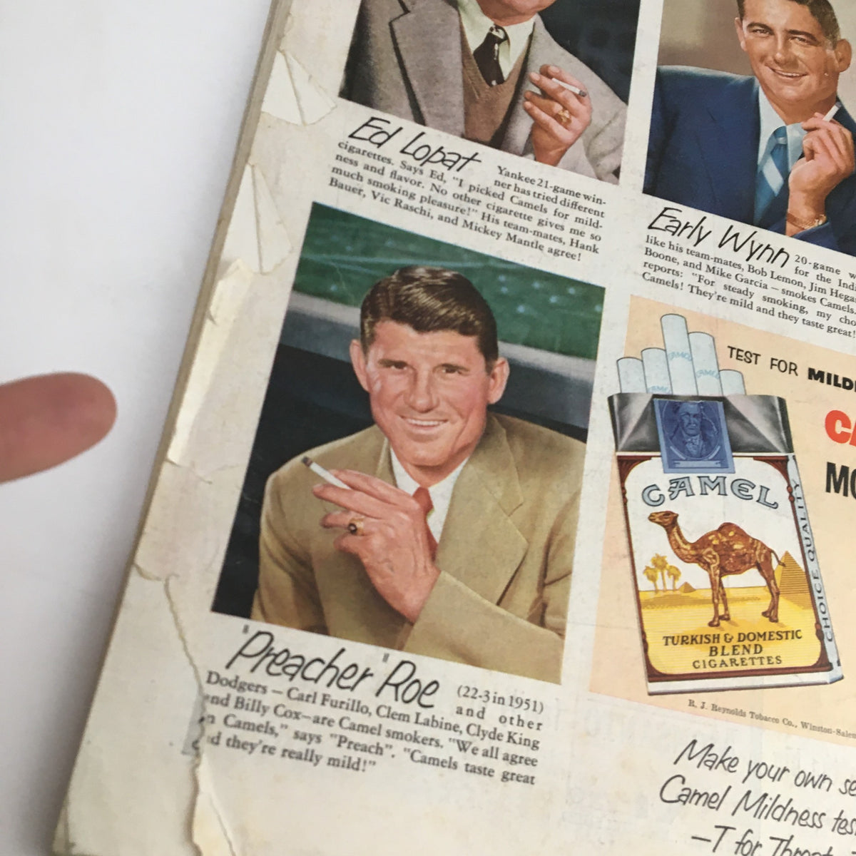 Detailed view of a vintage magazine advertisement from The Saturday Evening Post May 3 1952, highlighting baseball star Preacher Roe alongside Camel cigarettes.