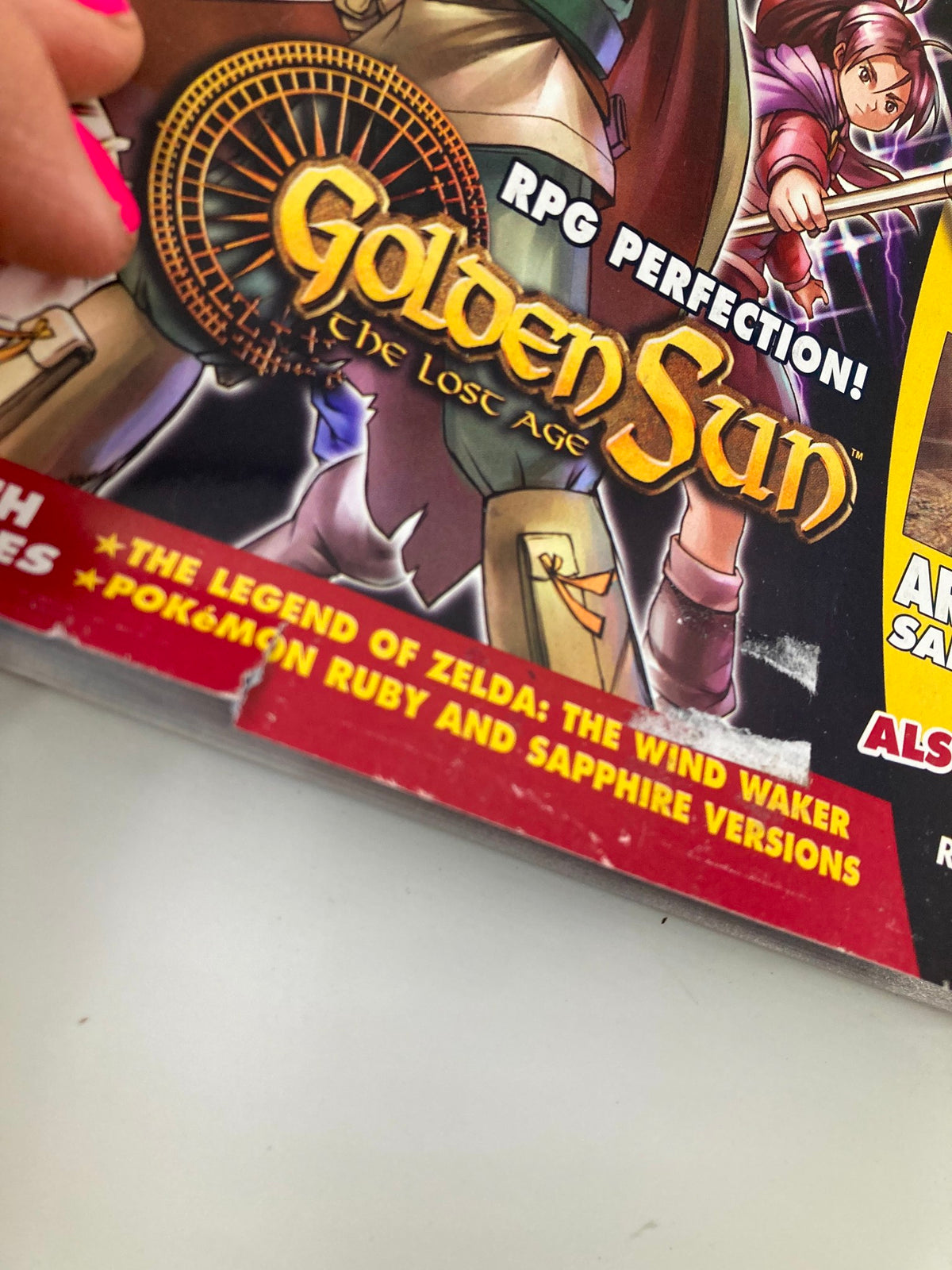 Close-up of the bottom corner of Nintendo Power Magazine May 2003 #168 displaying details on games covered including Golden Sun: The Lost Age.