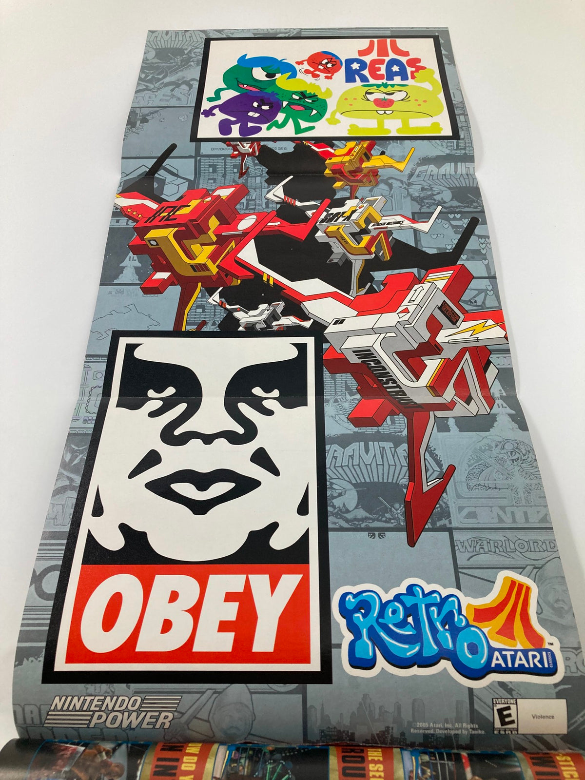 Poster included in Nintendo Power Magazine April 2005 #190, featuring colorful graphics and characters from the Retro Atari series, emphasizing the vintage gaming culture.