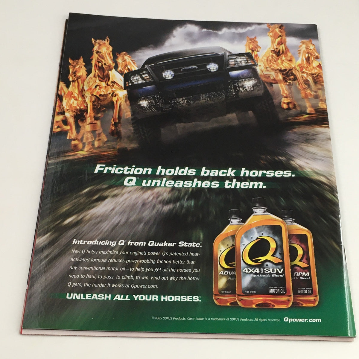 Back cover of WWE Raw Magazine March 2005 featuring an advertisement for Quaker State motor oil with a car and running horses, promoting the tagline 'Friction holds back horses. Q unleashes them.'