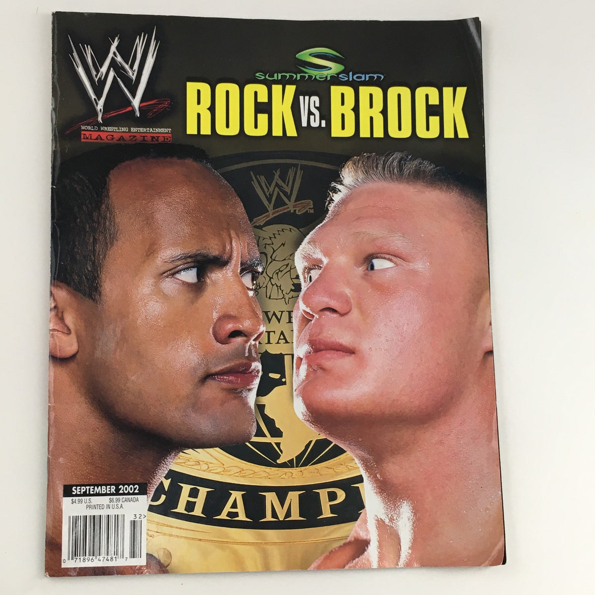 Cover of WWE Summer Slam Magazine from September 2002 featuring The Rock vs Brock Lesnar, showcasing a classic wrestling rivalry.