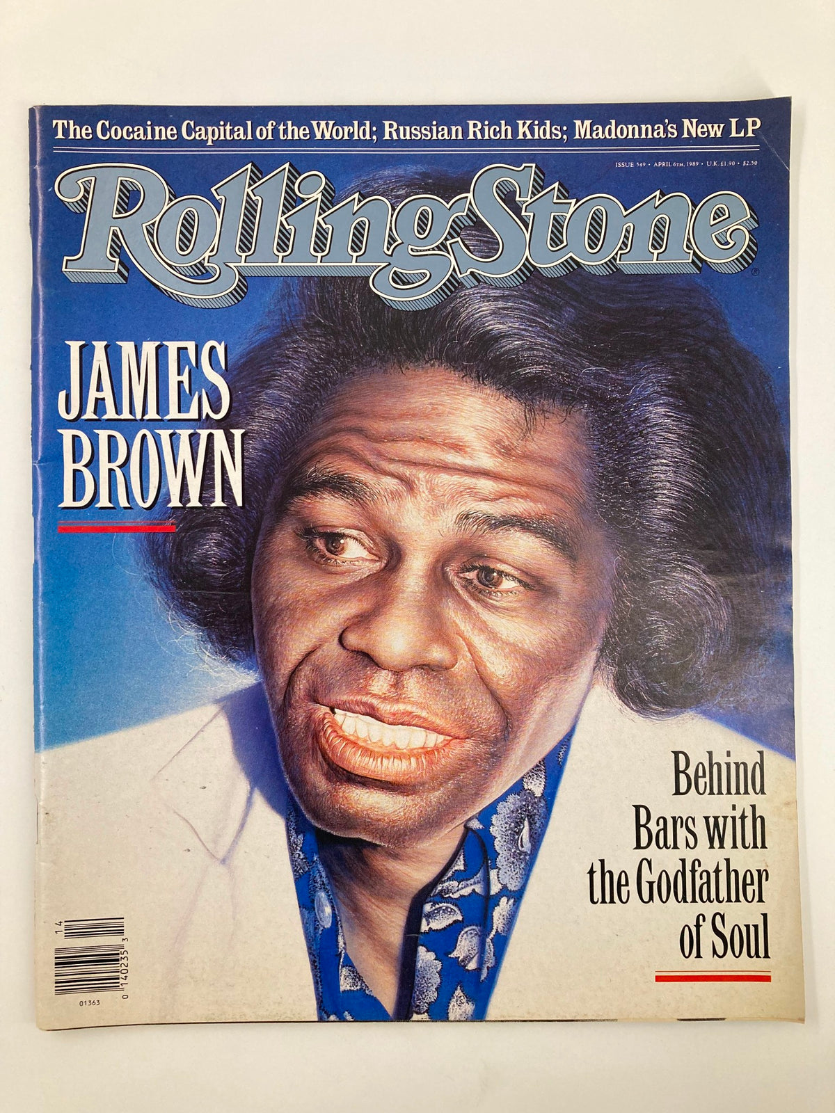 Vintage Rolling Stone Magazine cover from April 6, 1989 featuring James Brown, the Godfather of Soul, with the headline 'Behind Bars with the Godfather of Soul'. The cover showcases a portrait of James Brown, emphasizing his iconic hairstyle and style.