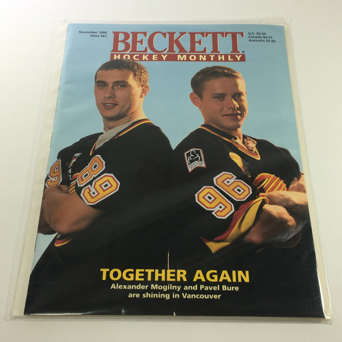 Beckett Hockey Monthly: November 1995 Issue #61 featuring Alexander Mogilny and Pavel Bure on the cover, highlighting their performance in Vancouver. The magazine is presented in plastic covering.
