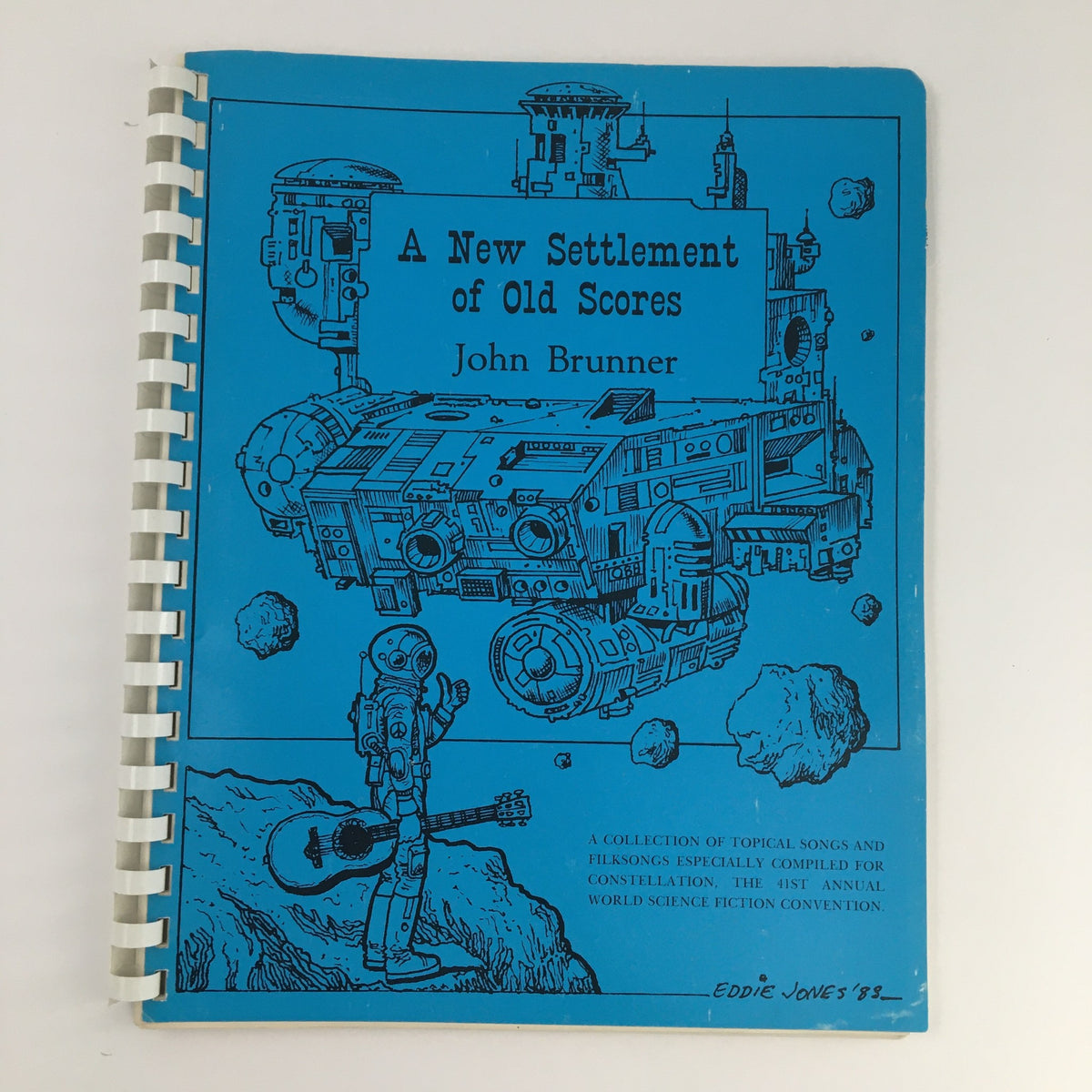 Cover of the North American Presents September 1979 Riverboat Filksing Souvenir Programme featuring a blue design with spaceship and robot illustrations.