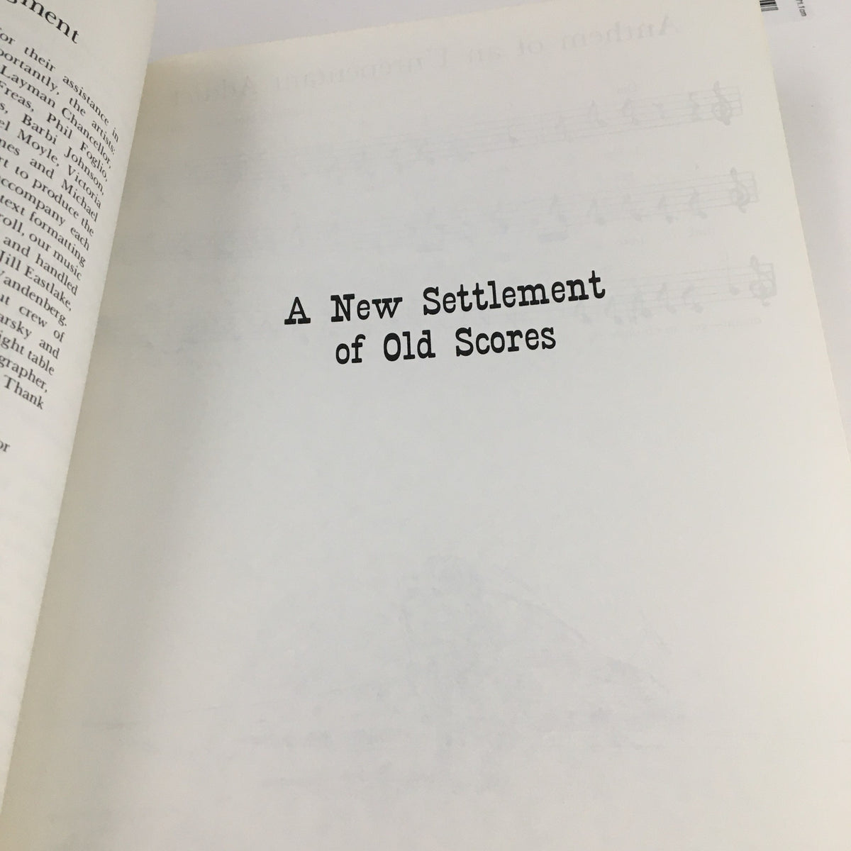 Interior page of 1988 A New Settlement of Old Scores by John Brunner, displaying the title of the collection printed in bold typeface on a blank background.