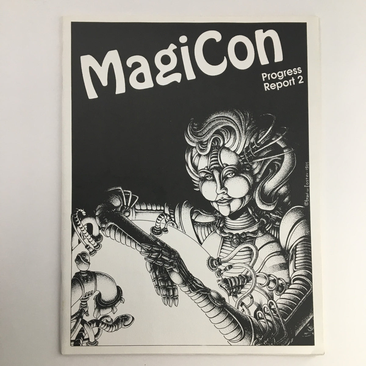 Cover of MagiCon Progress Report 2 from September 1992 featuring a stylized illustration of a robot woman, noted for its unique art style; includes the title 'MagiCon Progress Report 2' prominently displayed.