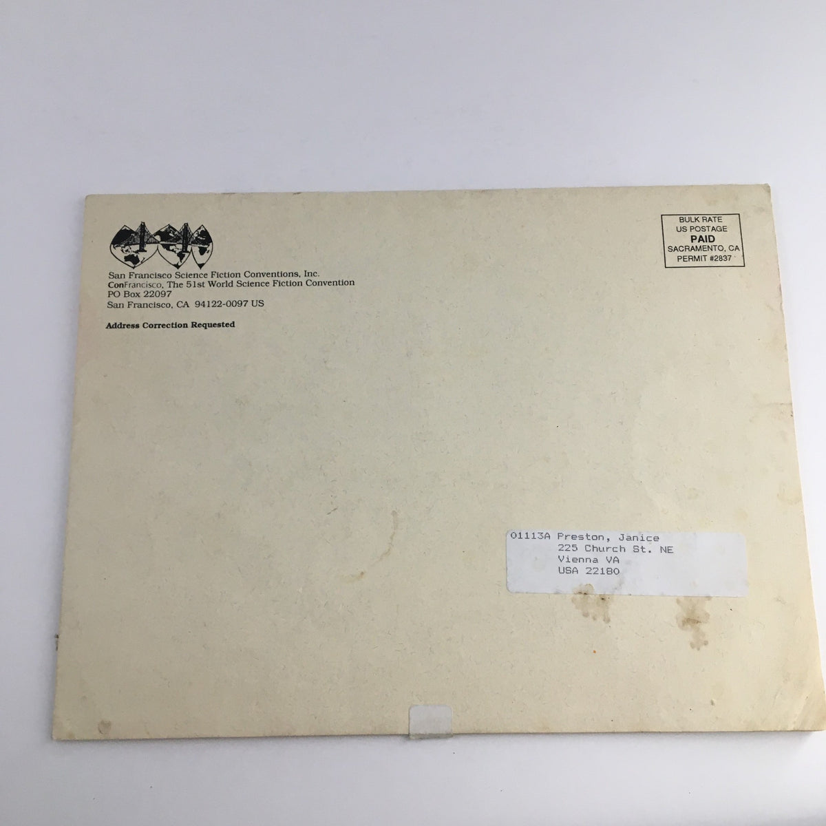 Back cover of the Con Francisco China Mall & Flying Dragon 1993 The 50th World Con Jack Vance with an address label and protective covering.