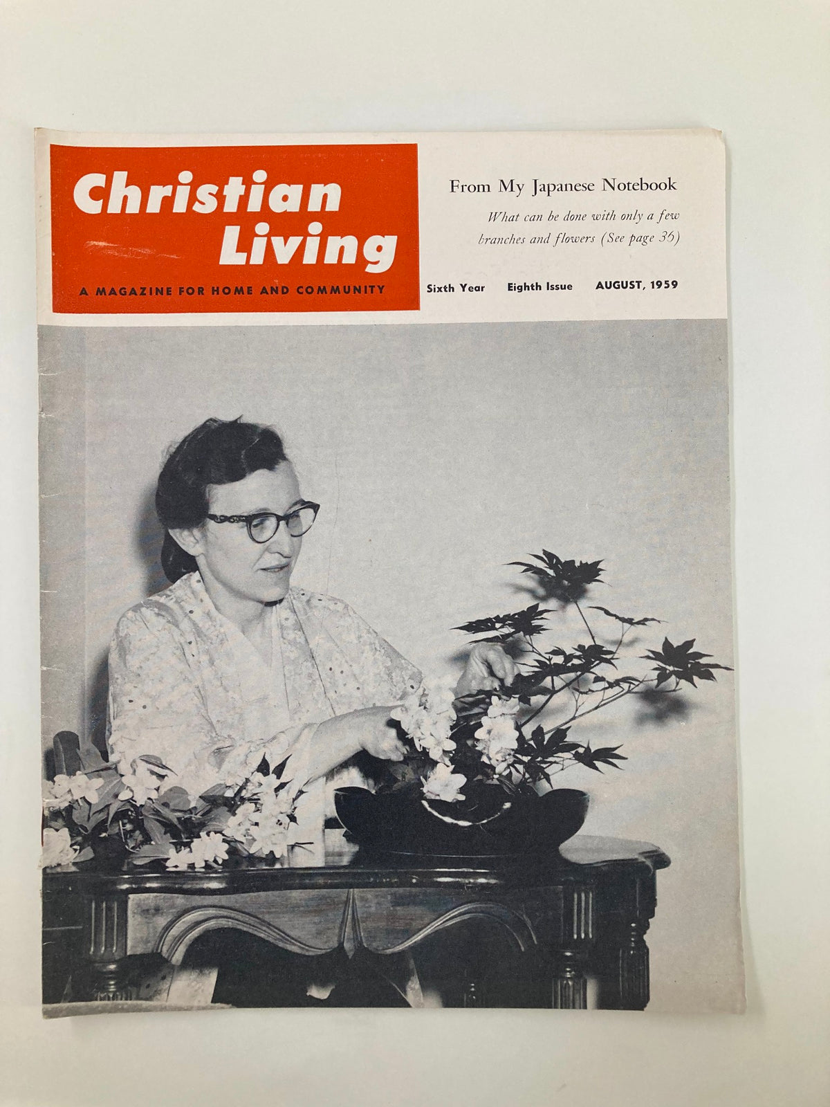 Cover of VTG Christian Living Magazine August 1959 titled 'From My Japanese Notebook', featuring a woman in traditional attire arranging flowers, showcasing vintage magazine design and aesthetics.