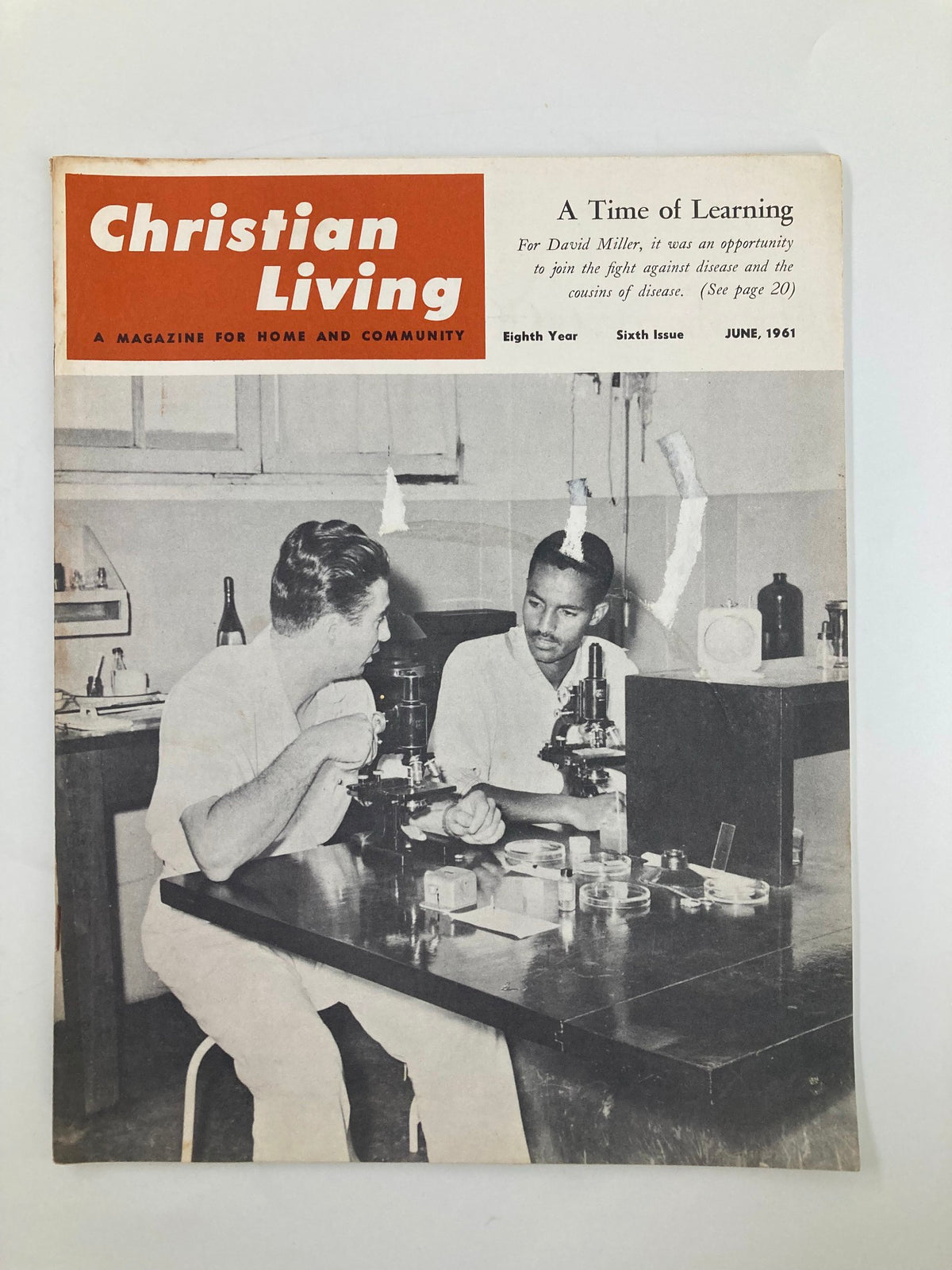 Cover of VTG Christian Living Magazine June 1961 featuring two men discussing scientifically in a laboratory setting, illustrating 'A Time of Learning'.