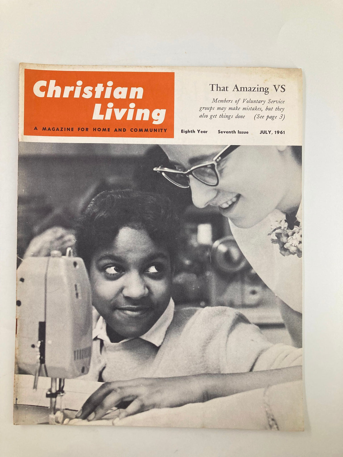 Vintage Christian Living Magazine July 1961 cover featuring a young girl sewing with a sewing machine and another woman assisting her. This issue highlights contributions from Fayetta Gordley.