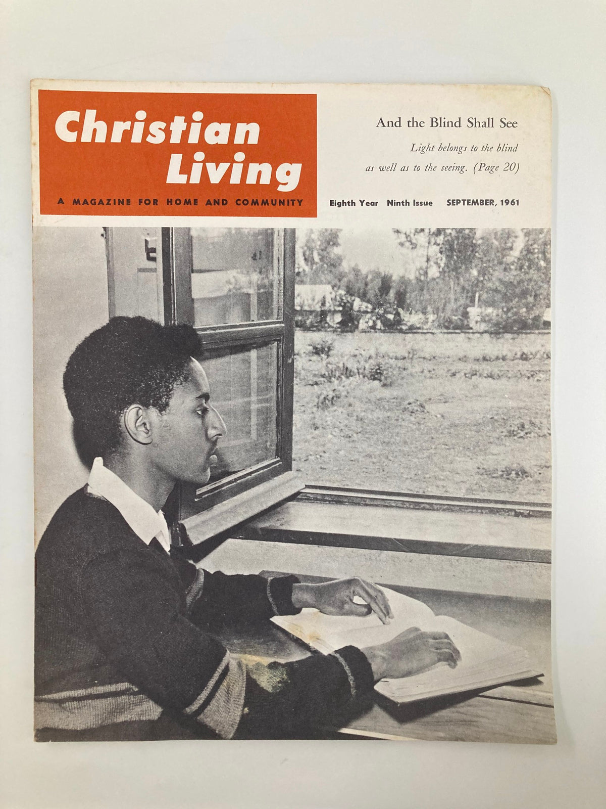 Cover of VTG Christian Living Magazine from September 1961 showcasing a young man reading a book by a window, highlighting themes of welfare and education, particularly in relation to the Blind School in Ethiopia.
