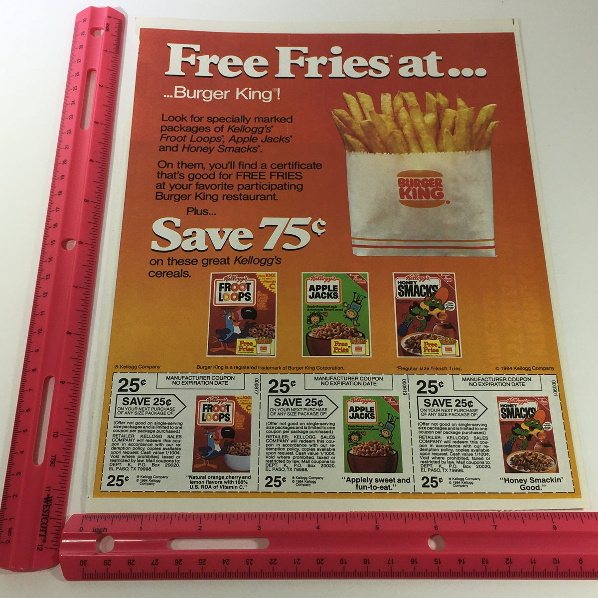 Kellogg's cereals advertisement featuring free Burger King fries offer and pricing for participating cereals, dated 1984.