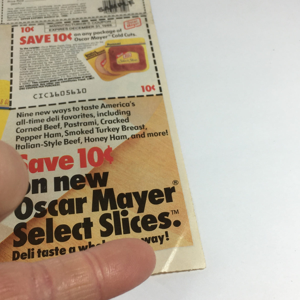 Close-up of the Oscar Mayer Select Slices coupon promotion from a vintage advertisement, unrelated to Meaty Bone Dog Biscuits.
