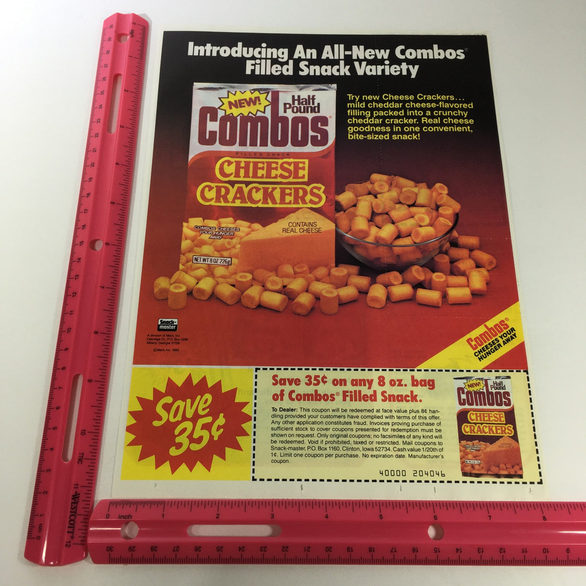 VTG Retro 1983 Combos Filled Snack Half Pound Cheese Crackers Print Ad accompanied by a ruler for size reference, emphasizing the classic snack's advertisement.