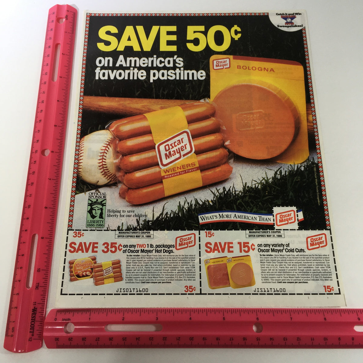 VTG Retro 1986 Oscar Mayer Hot Dogs Wieners & Bologna Cold Cuts Print Ad Coupon highlighting a colorful coupon ad with Oscar Mayer products, including hot dogs and bologna, against a grass background with a ruler for size reference.