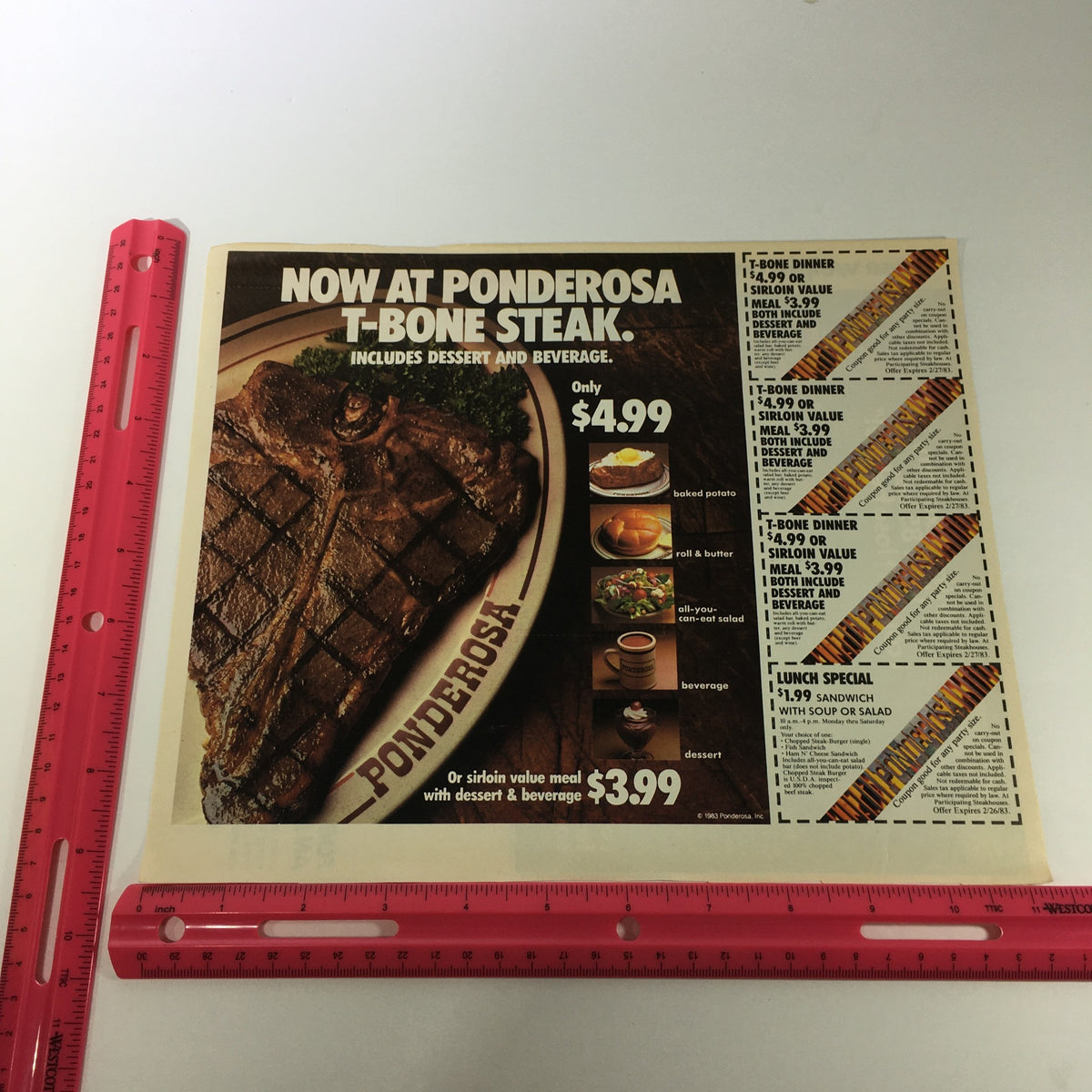 VTG Retro 1983 Ponderosa T-Bone Steak Sirloin Value Meal Print Ad Coupon displayed with a ruler for size reference, highlighting the advertisement for a T-Bone meal deal at Ponderosa.