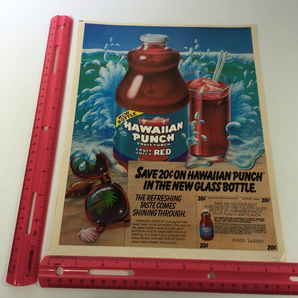 VTG Retro 1985 Hawaiian Punch Fruit Punch Fruit Juice Print Ad Coupon featuring a vibrant advertisement with a red Hawaiian Punch bottle in waves, highlighting a 20-cent savings offer and showcasing promotional details.