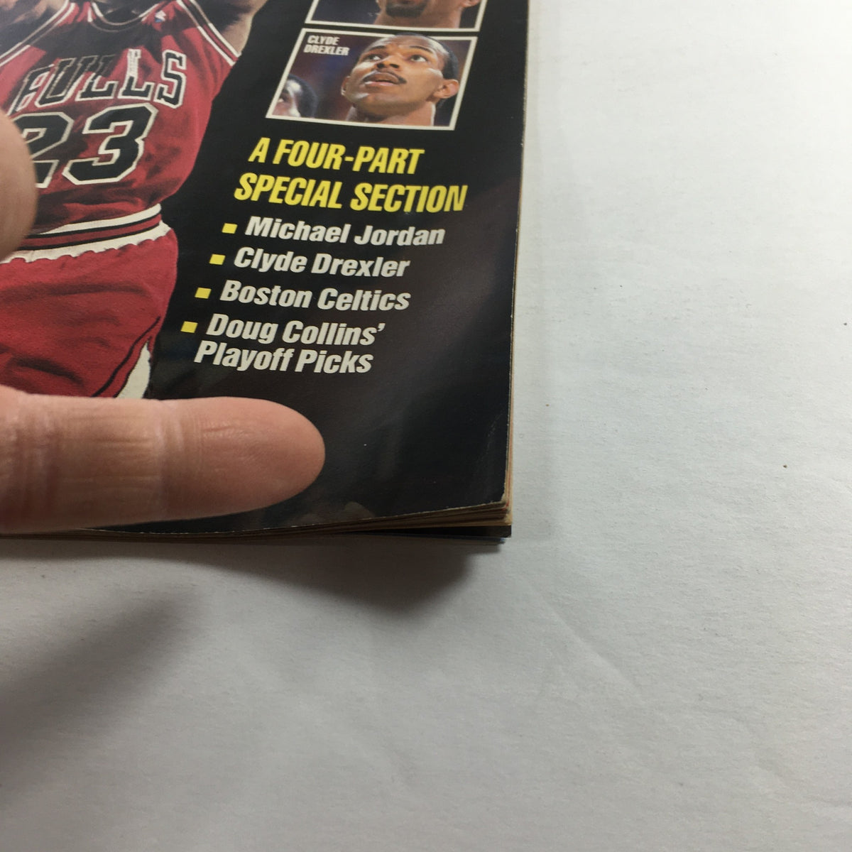 Close-up view of VTG Inside Sports Magazine May 1991 Vol. 13, displaying a list of featured articles including Michael Jordan, Clyde Drexler, and Doug Collins' playoff picks.