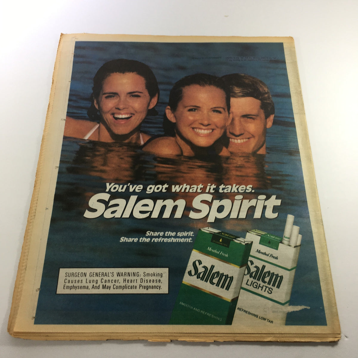 Vintage advertisement for Salem cigarettes featuring three smiling individuals in a pool, showcasing the slogan 'You've got what it takes. Salem Spirit.' This ad is part of a collectible magazine, The Sporting News, September 1, 1966, featuring Yankees' Don Mattingly & Rickey Henderson.
