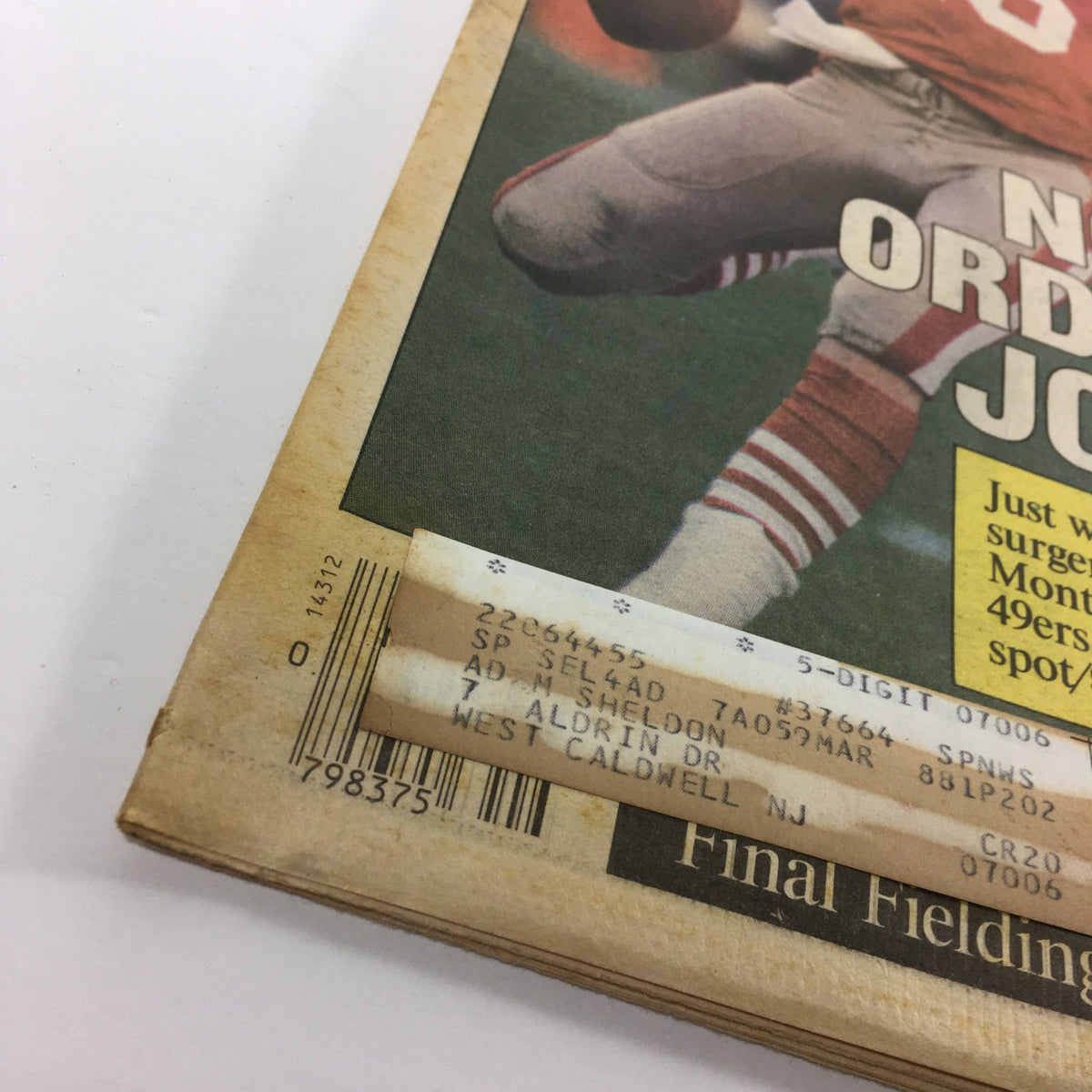 Close-up of the bottom edge of VTG The Sporting News December 8 1986, showing address label and magazine details.