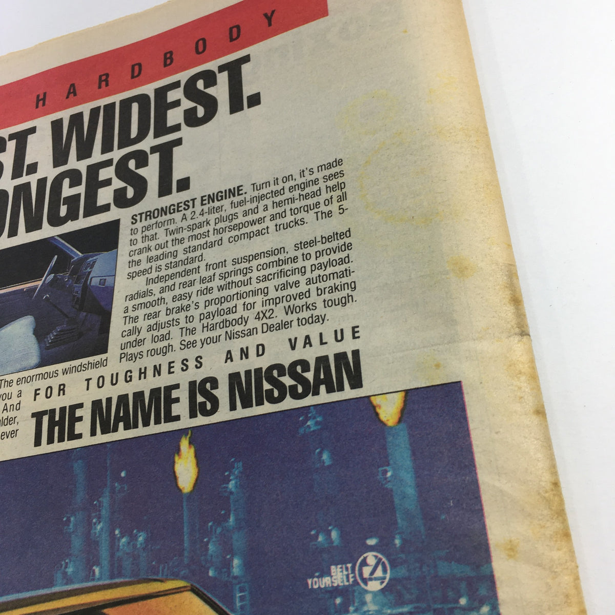 Detailed view of the Nissan Hardbody advertisement from VTG The Sporting News December 8 1986 featuring specifications and promotional text.