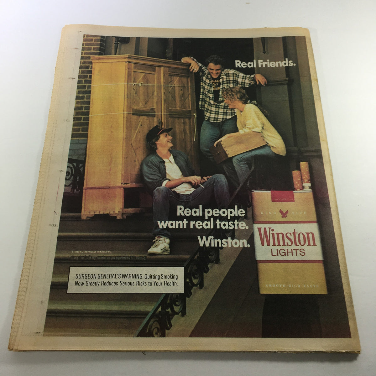 Ad from the back of VTG The Sporting News January 4 1988 - NFL Jerry Rice / Special Double Issue, featuring a Winston Lights cigarette advertisement with a casual gathering of friends.