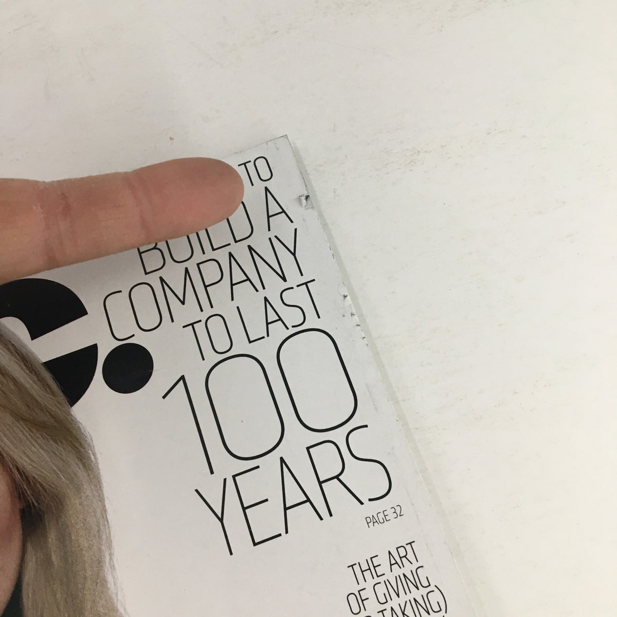 Close-up of the spine of Inc. Magazine October 2015, indicating a feature on building a company to last 100 years, with page number 32 highlighted.