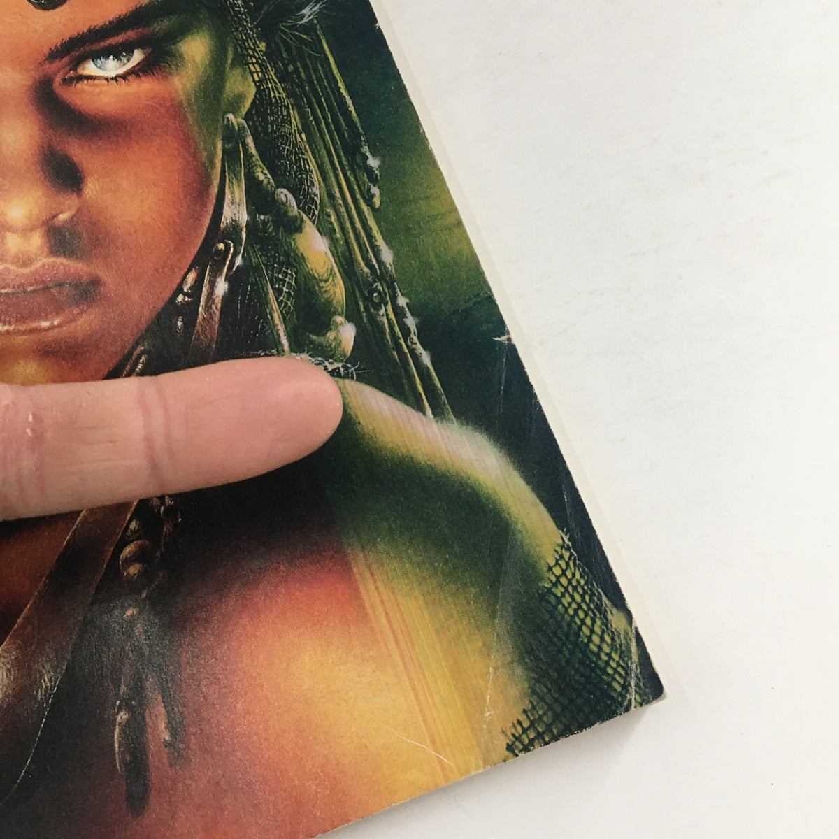 Close-up of the cover of Heavy Metal Fantasy Magazine September 1990, highlighting the fierce character's face and intricate detailing.