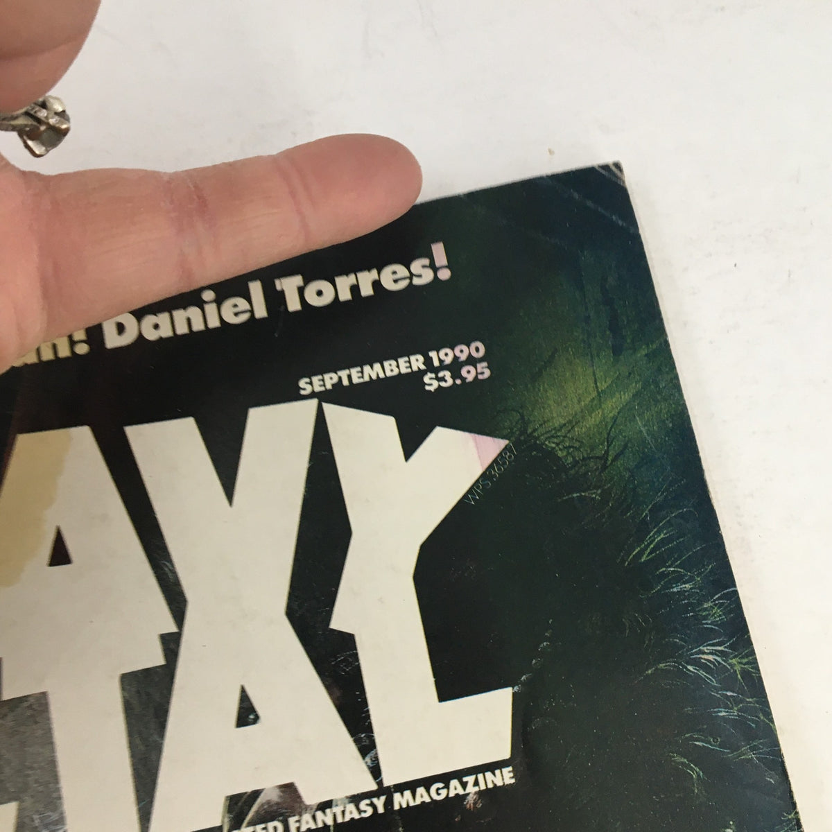 Detail shot of the Heavy Metal Fantasy Magazine September 1990 cover, focusing on the title and publication date.