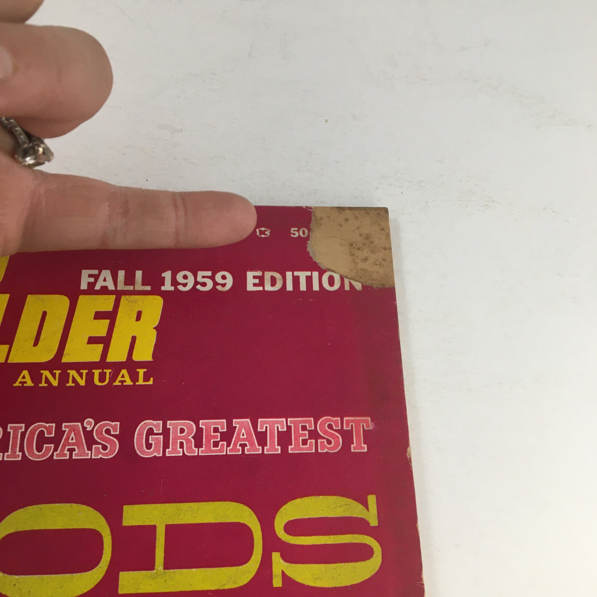 Close-up view of the Rod Builder Annual Fall 1959 Edition magazine cover, highlighting the wear on the top corner while displaying the vibrant title and edition details.