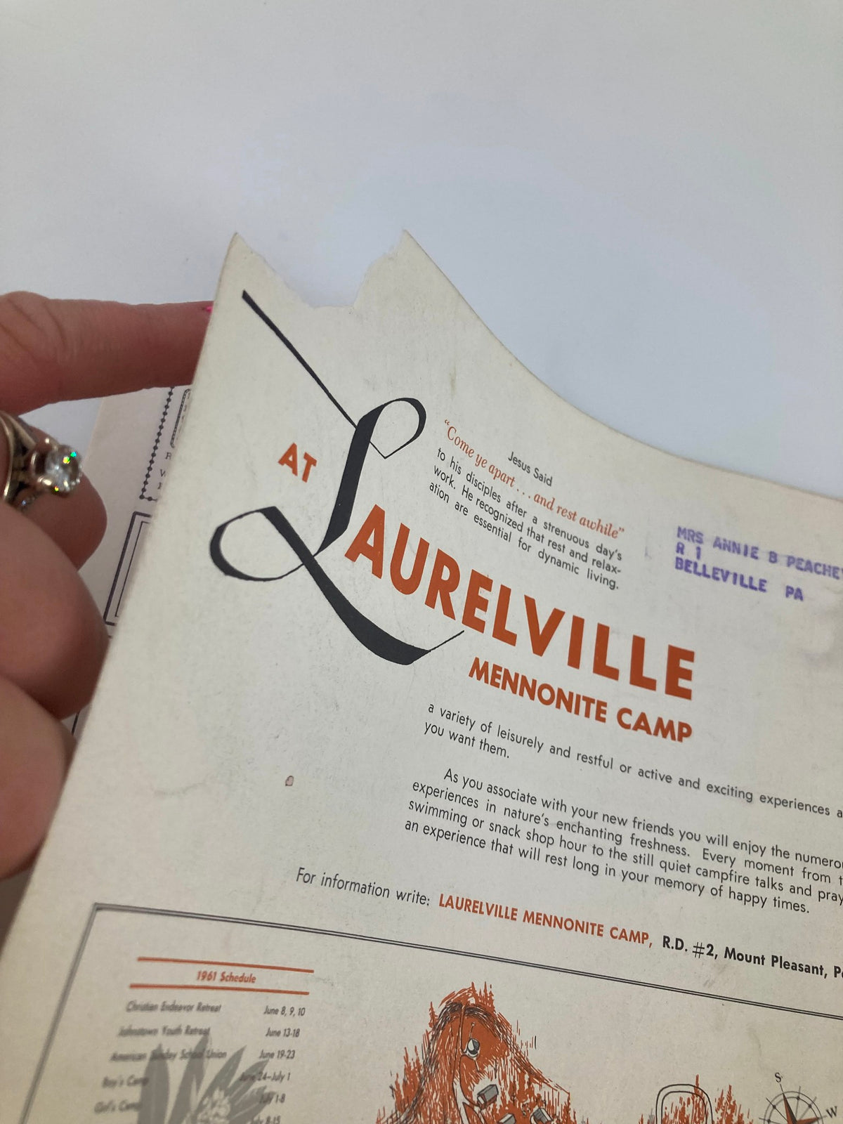 Detailed view of the back cover of VTG Christian Living Magazine May 1961, highlighting the Laurelville Mennonite Camp text and a small tear on the edge.