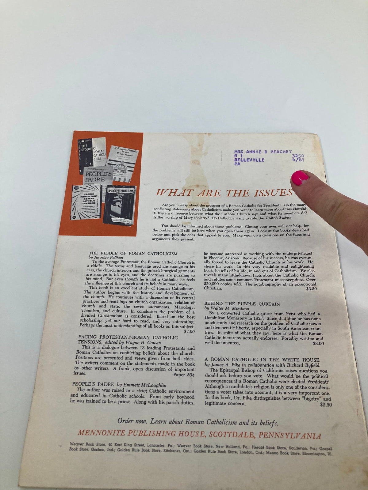 Back cover of Vintage Christian Living Magazine November 1960, includes information on Roman Catholicism books and a mailing label addressed to Mrs. Annie B. Peachey.