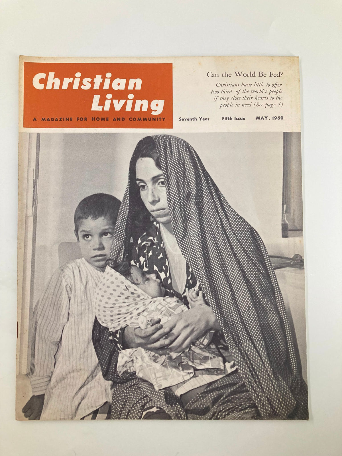 Cover of VTG Christian Living Magazine May 1960 titled 'Christians Have Little To Offer' featuring a woman in a traditional outfit holding a baby with a young boy beside her.