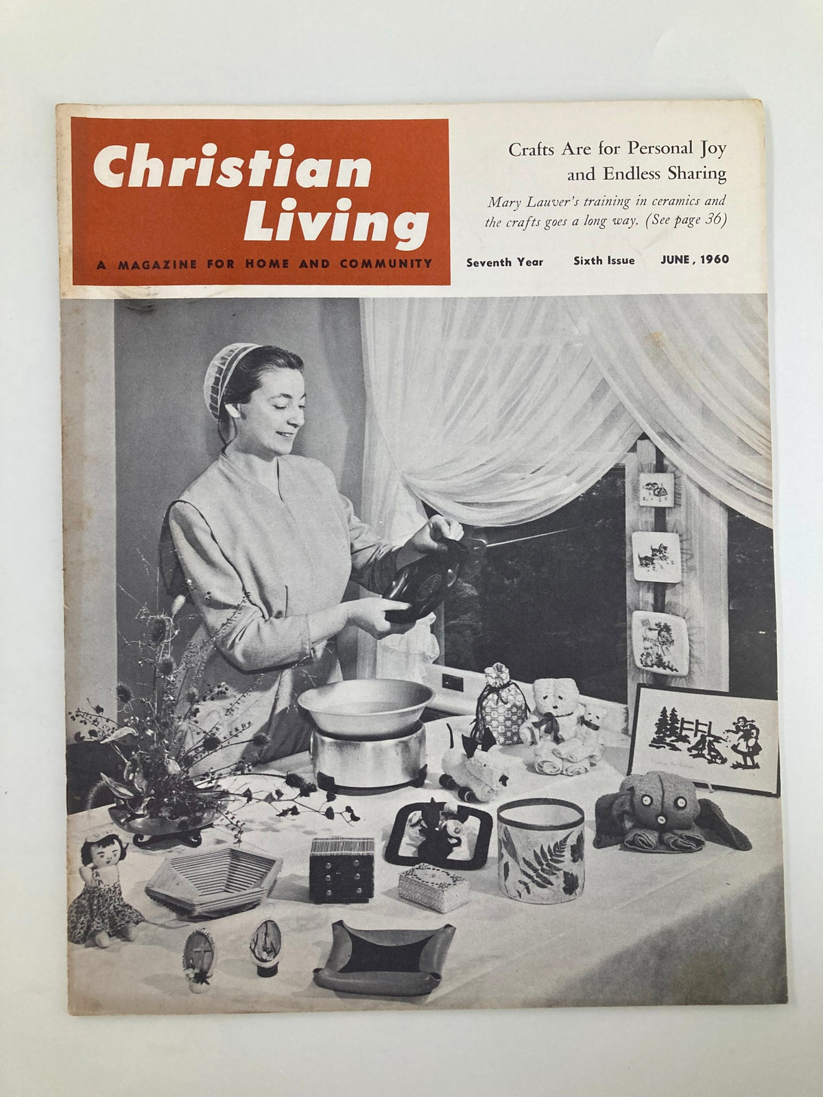 Cover of VTG Christian Living Magazine June 1960 featuring a woman demonstrating crafts with various handmade items, highlighting the theme 'Crafts Are for Personal Joy and Sharing.'