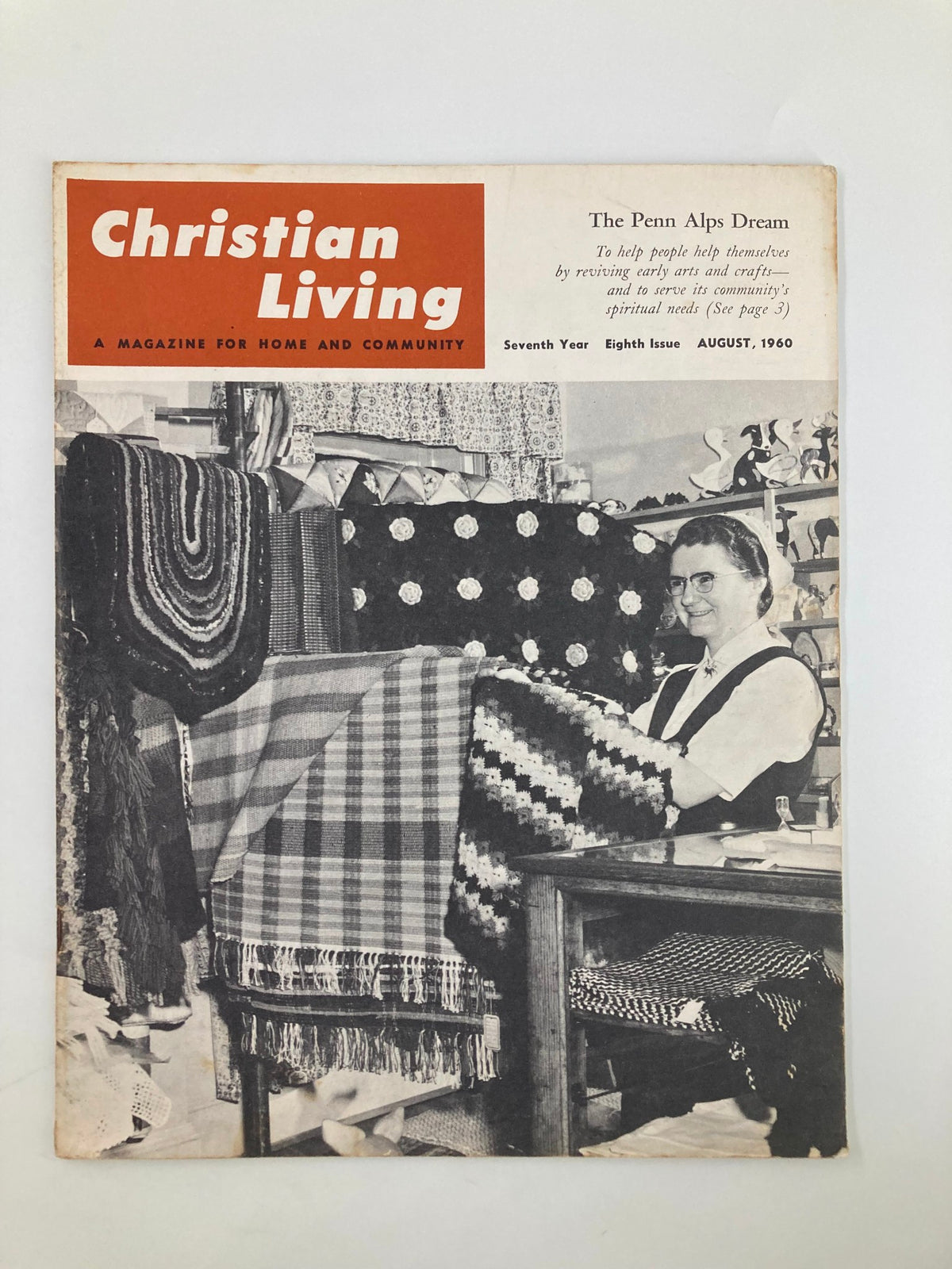 Cover of VTG Christian Living Magazine August 1960 featuring the title 'The Penn Alps Dream' with an image of a woman sitting in a crafts shop surrounded by handmade textiles and decorations.