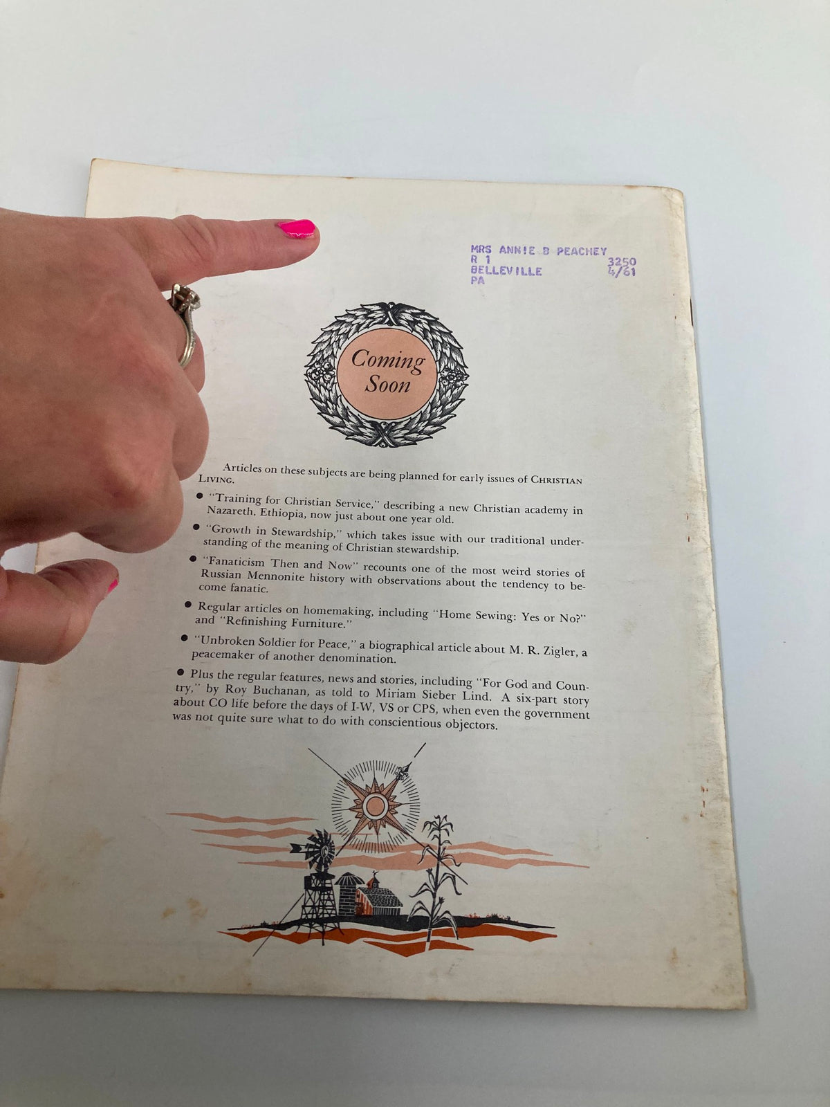Back cover of VTG Christian Living Magazine August 1960 with an illustration and the text 'Coming Soon', along with a mailing label addressed to Mrs. Annie B. Peachey.