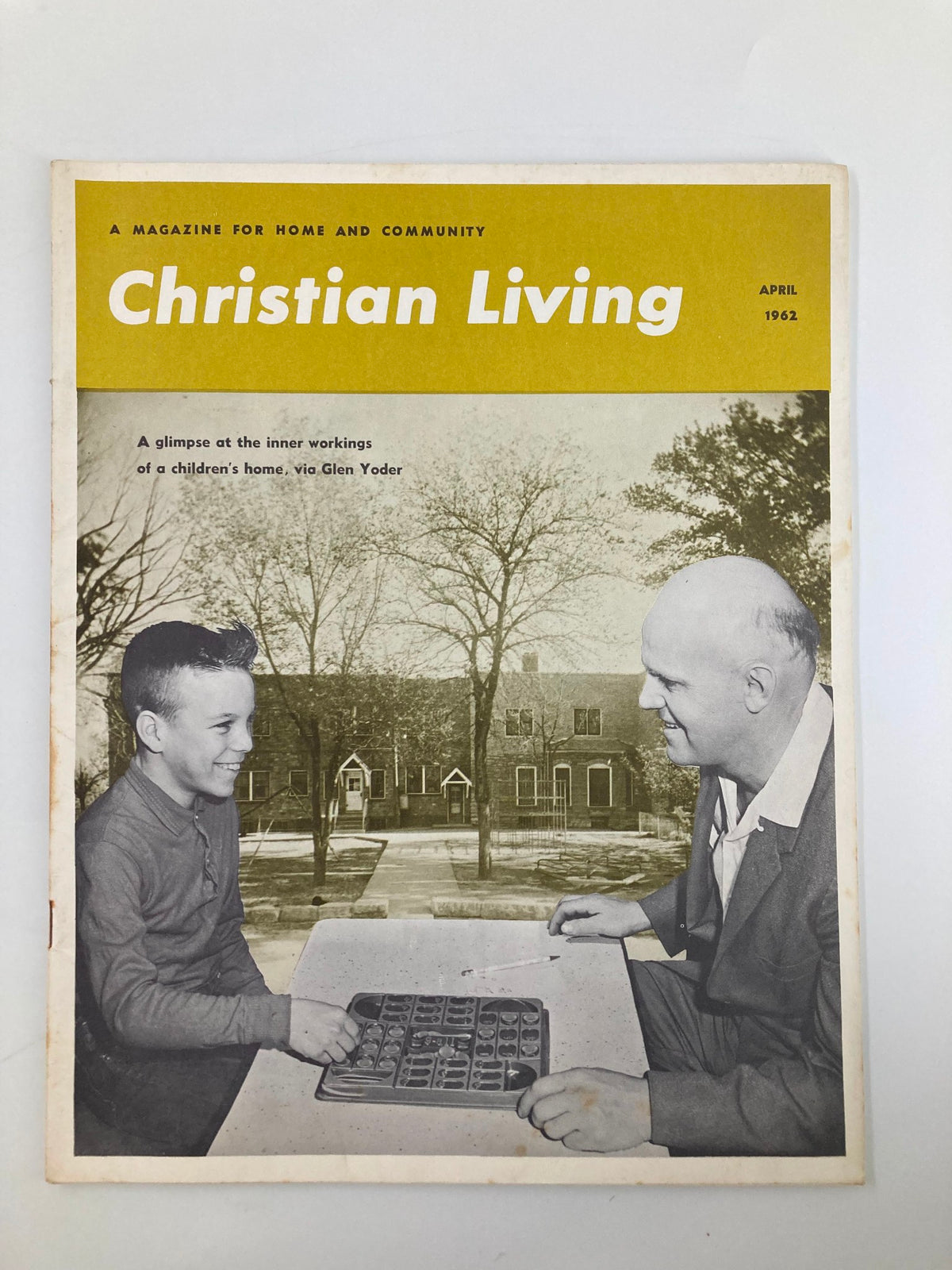 Cover of the VTG Christian Living Magazine April 1962 featuring a photo of Larry and Uncle Glen Yoder, showcasing a nostalgic snapshot of Christian culture from the early 1960s.
