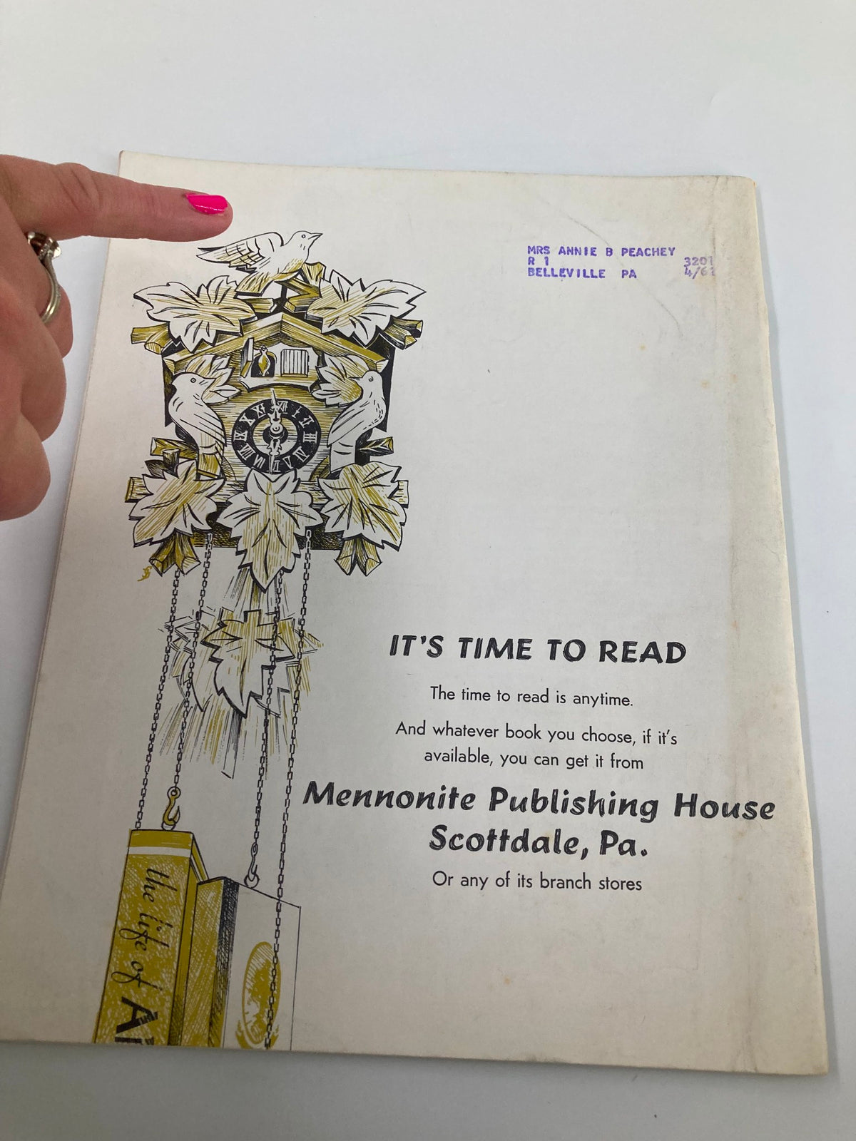 Back cover of VTG Christian Living Magazine February 1962, highlighting a vintage design with a clock and birds, along with a label addressing Mrs. Annie B. Peachey.