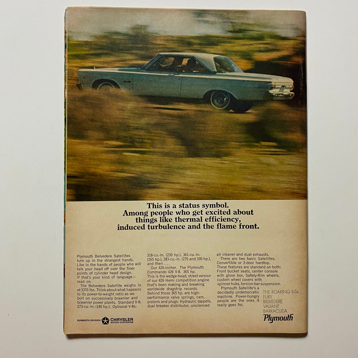Back cover of VTG Hot Rod Magazine August 1965, featuring a classic Plymouth vehicle advertisement emphasizing style and performance.