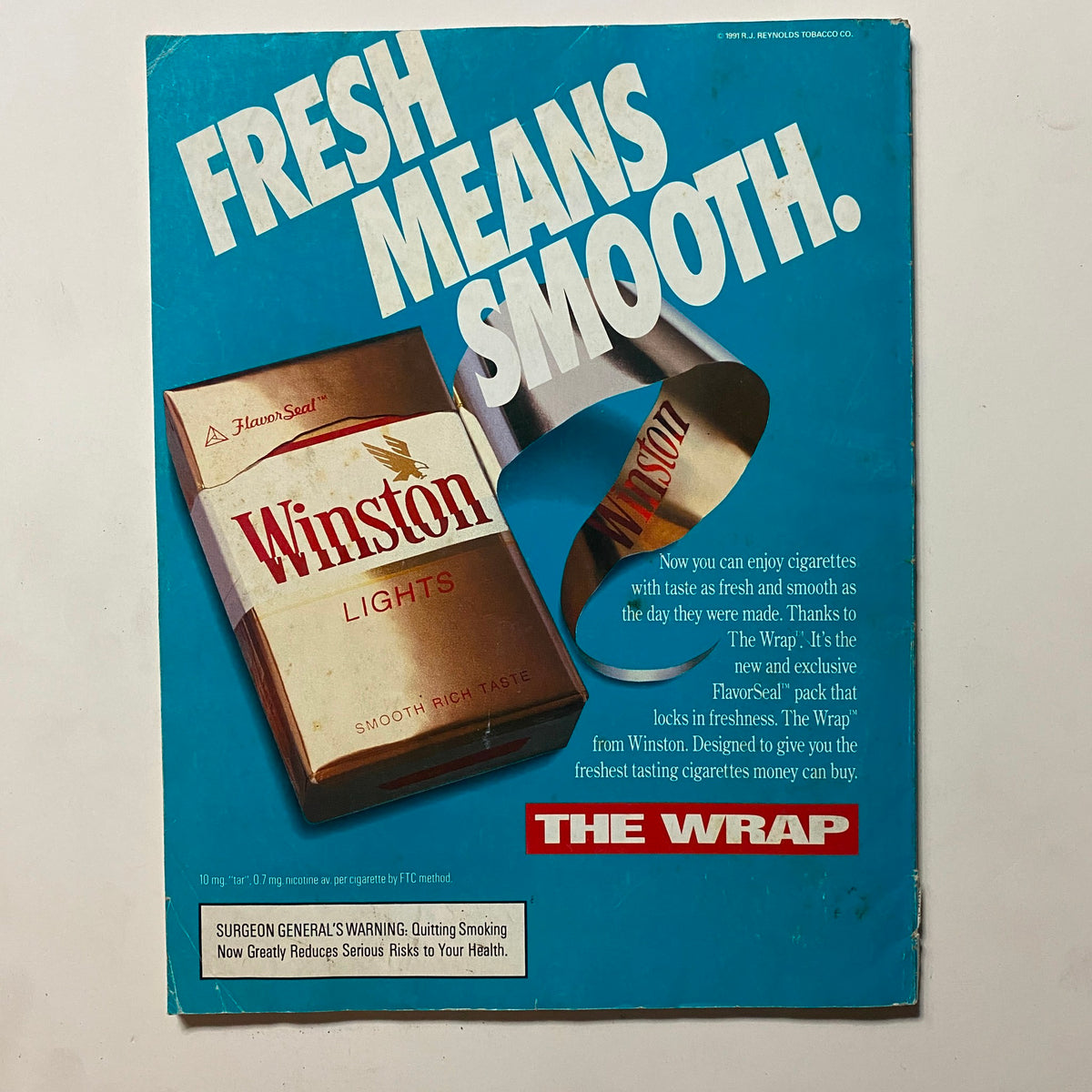 Back cover of Omni Magazine January 1992 Vol 14 No. 4, highlighting a vintage Winston Lights advertisement with a blue background and an eye-catching design, representing the era's marketing aesthetics.