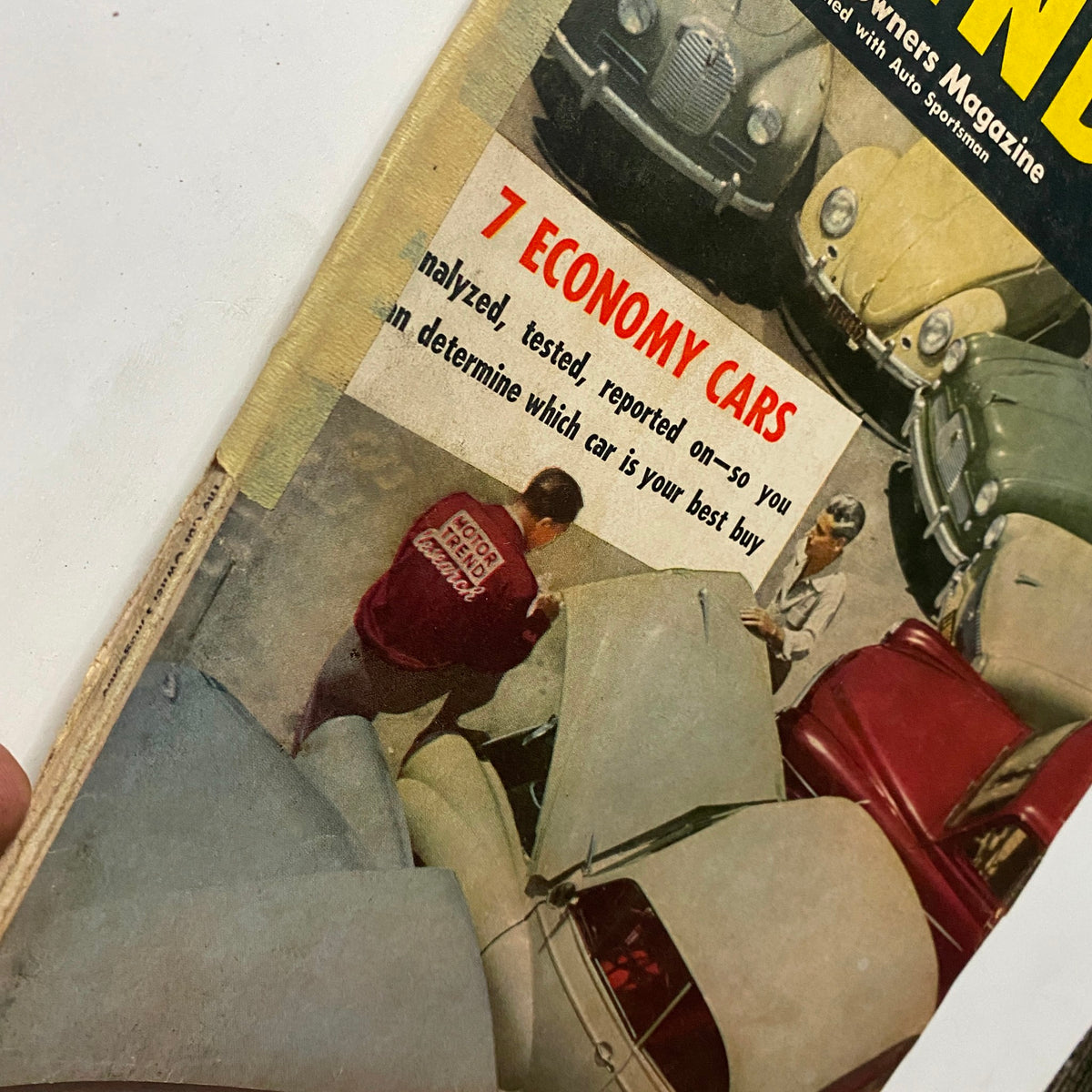Cover of VTG Motor Trend Magazine October 1953 featuring the article '7 Economy Cars' showcasing mid-century automotive culture.