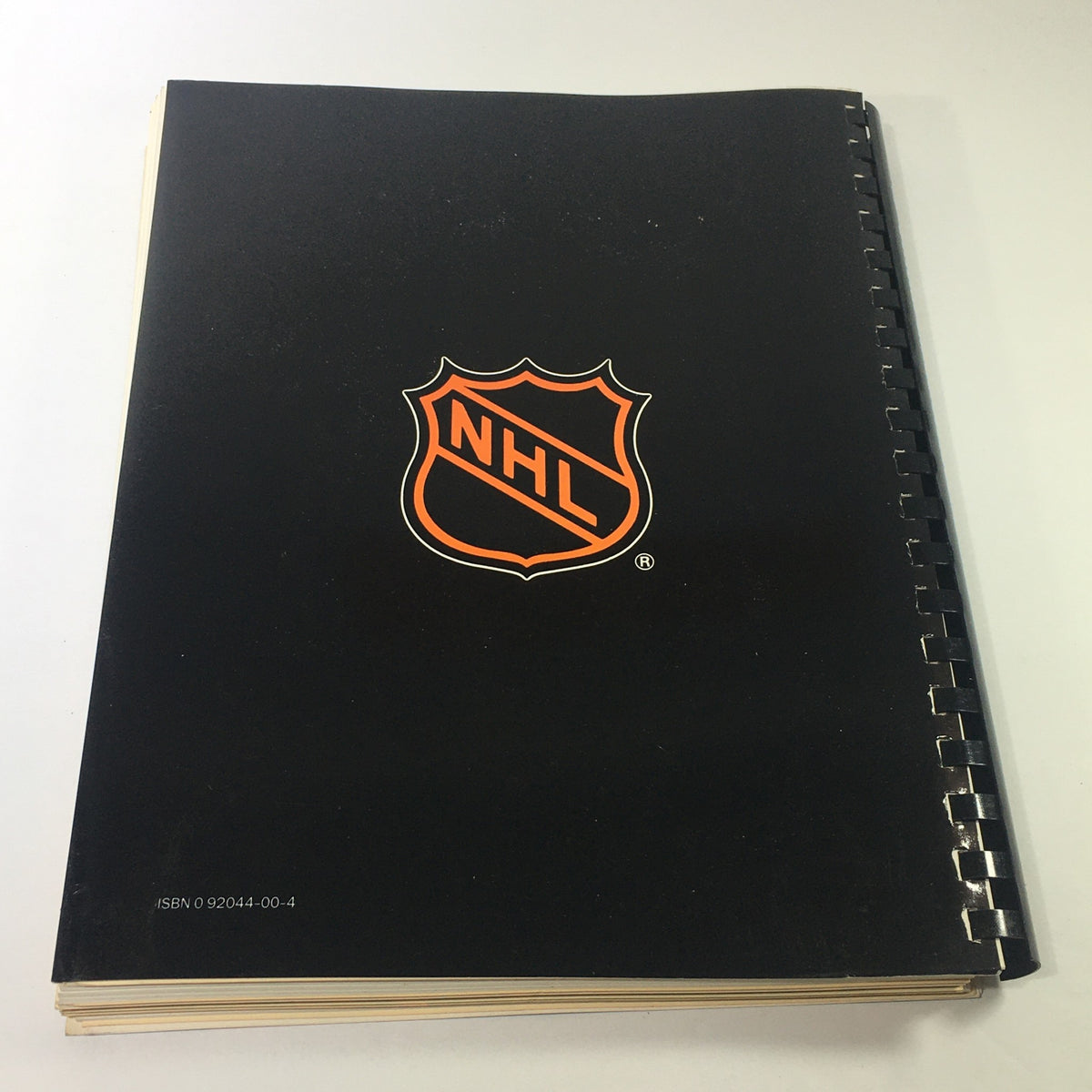 Rear cover of the VTG NHL Official Guide & Record Book 1984-1985, featuring the NHL logo on a black background.