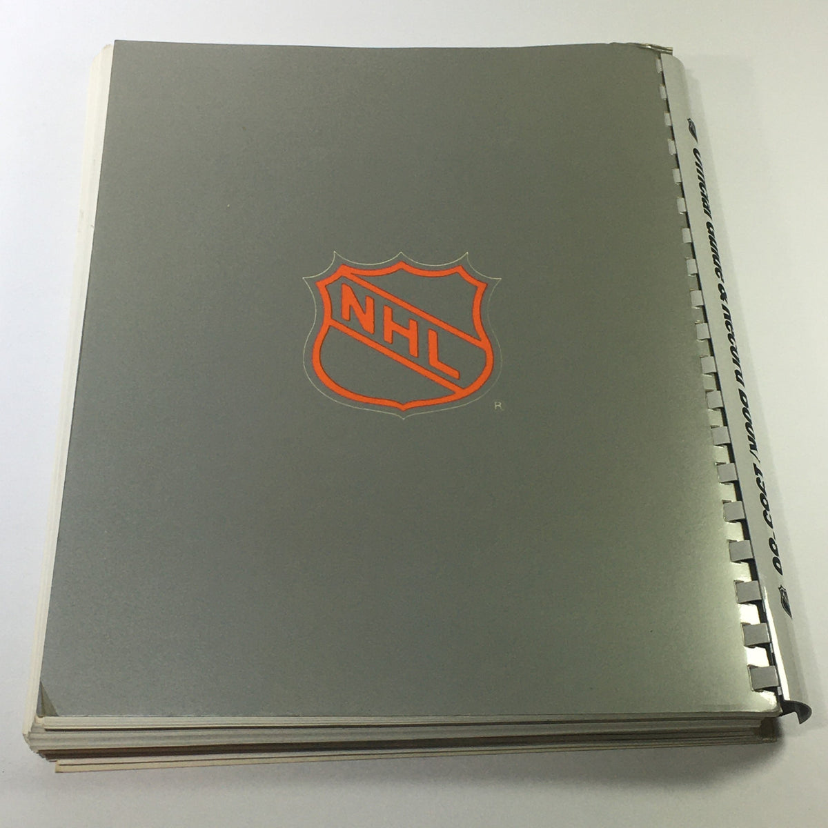 Cover of the VTG NHL Official Guide & Record Book 1985-1986 featuring the NHL logo, showcasing retro design elements related to the Edmonton Oilers and Wayne Gretzky.