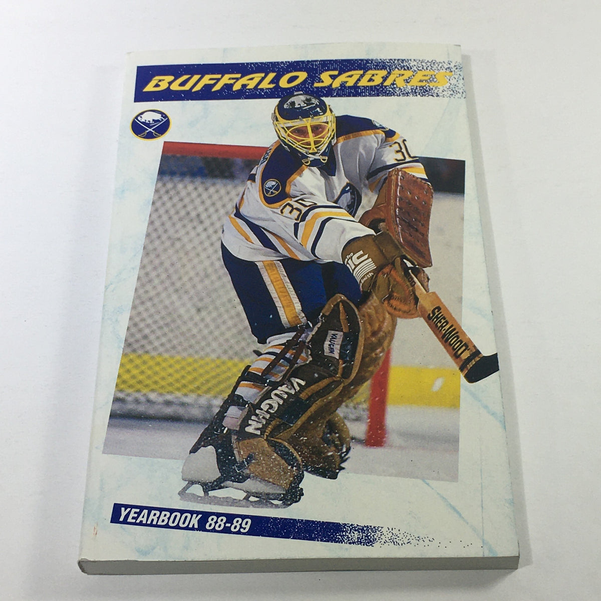Vintage NHL official yearbook 1988-1989 featuring the Buffalo Sabres and Clint Malarchuk on the cover, showcasing a goaltender in action.
