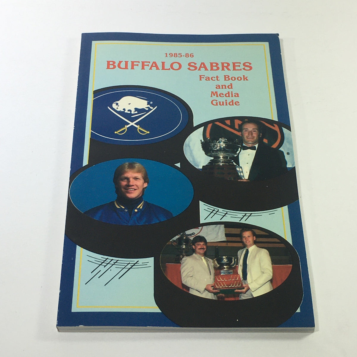 VTG NHL Buffalo Sabres 1985-1986 Fact Book and Media Guide cover featuring team logo and images of players, highlighting the season's key moments.