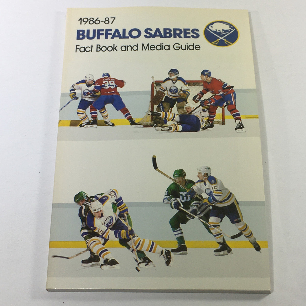 Cover of the VTG NHL 1986-1987 Buffalo Sabres Fact Book and Media Guide featuring action shots of players in a hockey game.