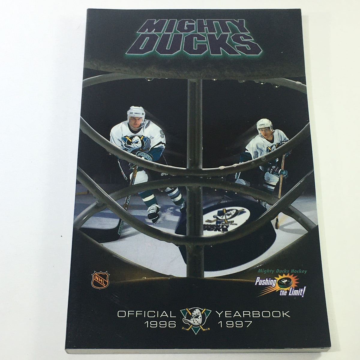 VTG NHL Official Yearbook 1996-1997 featuring the Mighty Ducks of Anaheim and Paul Kariya, showcasing hockey players on the cover with a dynamic design.