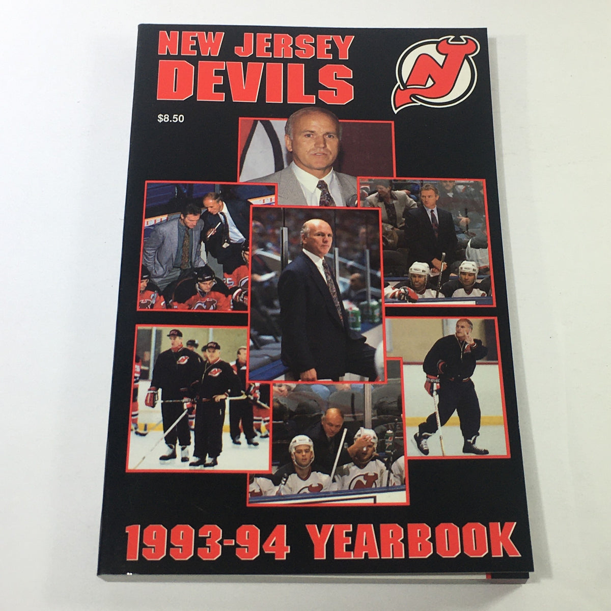 VTG NHL Official Yearbook 1993-1994 featuring the New Jersey Devils and Coach Jacques Lemaire, showcasing a variety of images of the team, coaching staff, and players on the cover.