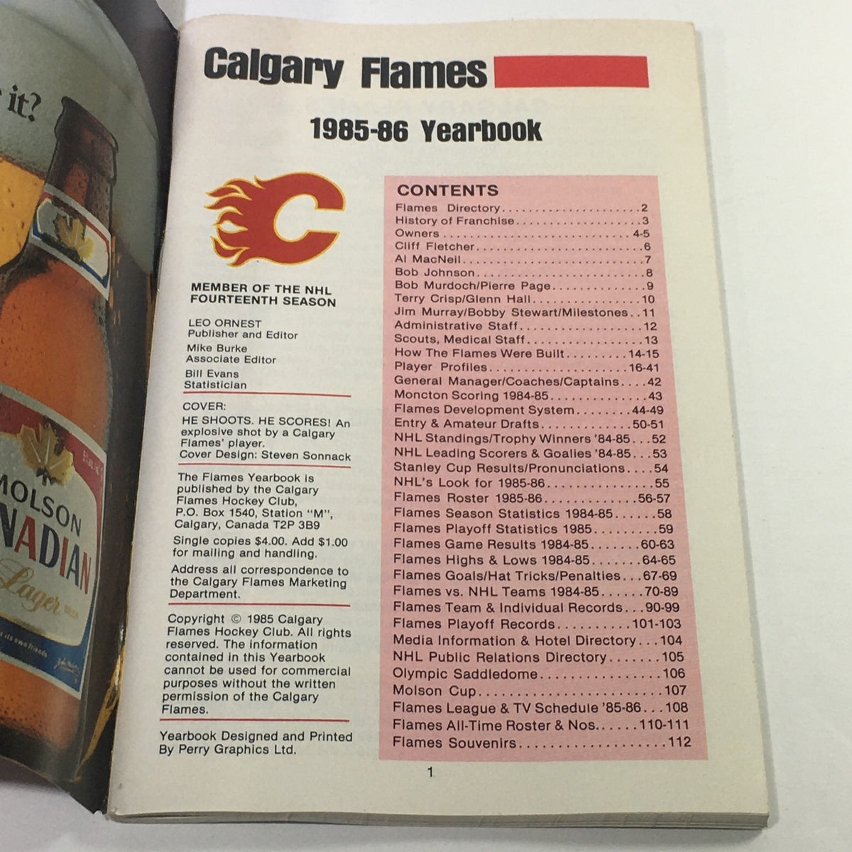 Interior page of the VTG NHL Official Yearbook 1985-1986, displaying the Calgary Flames' yearbook contents including directory and historical details.